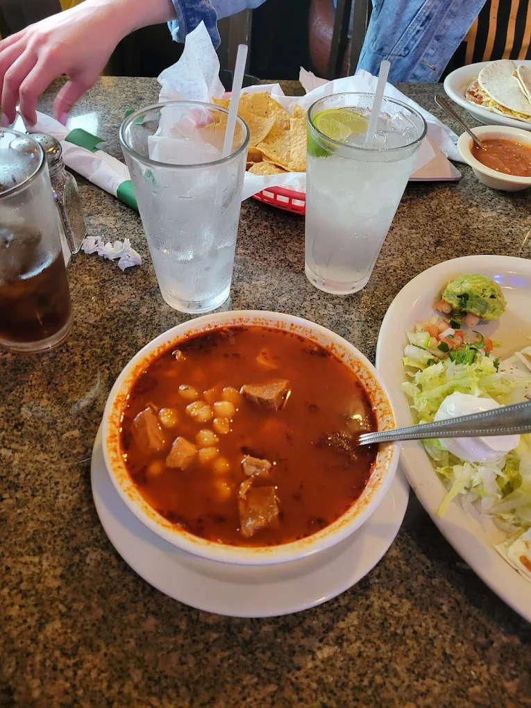Homemade Menudo - Traditional Mexican soup with beef tripe in a rich red chile broth