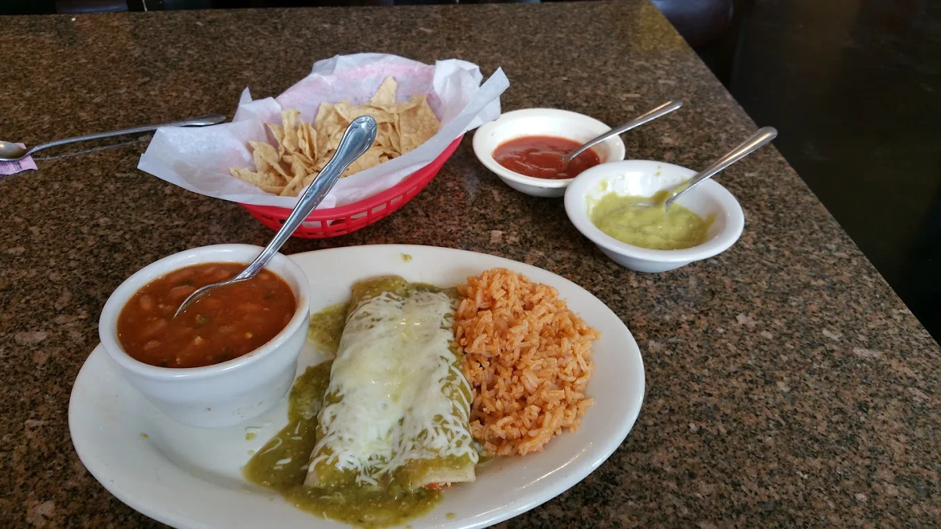 Lunch Carne Guisada Enchiladas - Tender beef stew enchiladas topped with gravy and cheese